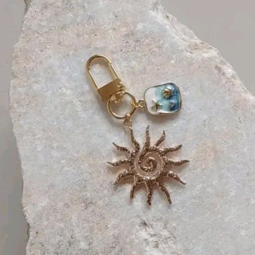 Golden Sun Bagcharms & Pearls Wristlet